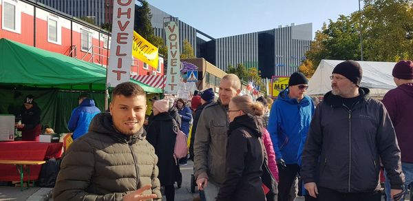 People standing on street in city