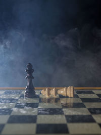 Close-up of chess pieces on table