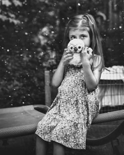 Portrait of a girl holding camera