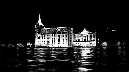 Reflection of building in water at night