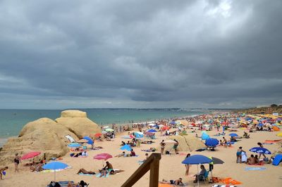 People relaxing on beach