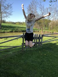 Full length of happy man standing on field