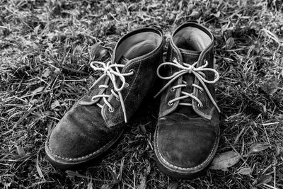 High angle view of shoes on field