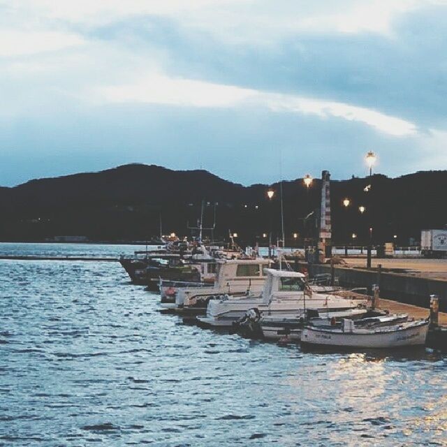 nautical vessel, transportation, water, boat, mode of transport, sky, waterfront, sea, moored, mountain, cloud - sky, nature, tranquility, harbor, rippled, pier, tranquil scene, travel, cloud, built structure