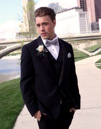 Young man standing in city