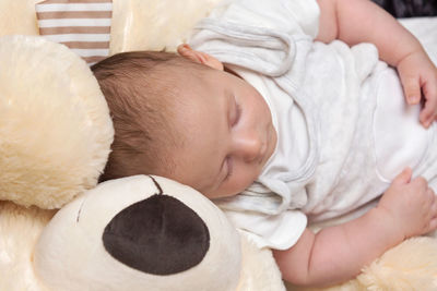 Cute baby sleeping in bed