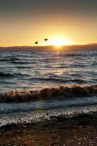 Scenic view of sea against sky during sunset