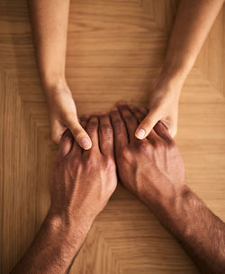 Cropped image of people on table