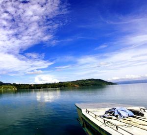 Scenic view of lake against cloudy sky