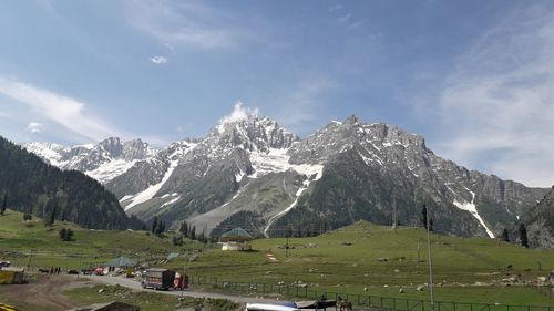 Scenic view of snowcapped mountains against sky