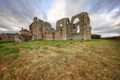 View of old ruins against cloudy sky