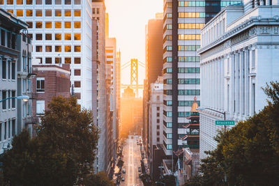 City street amidst buildings against sky