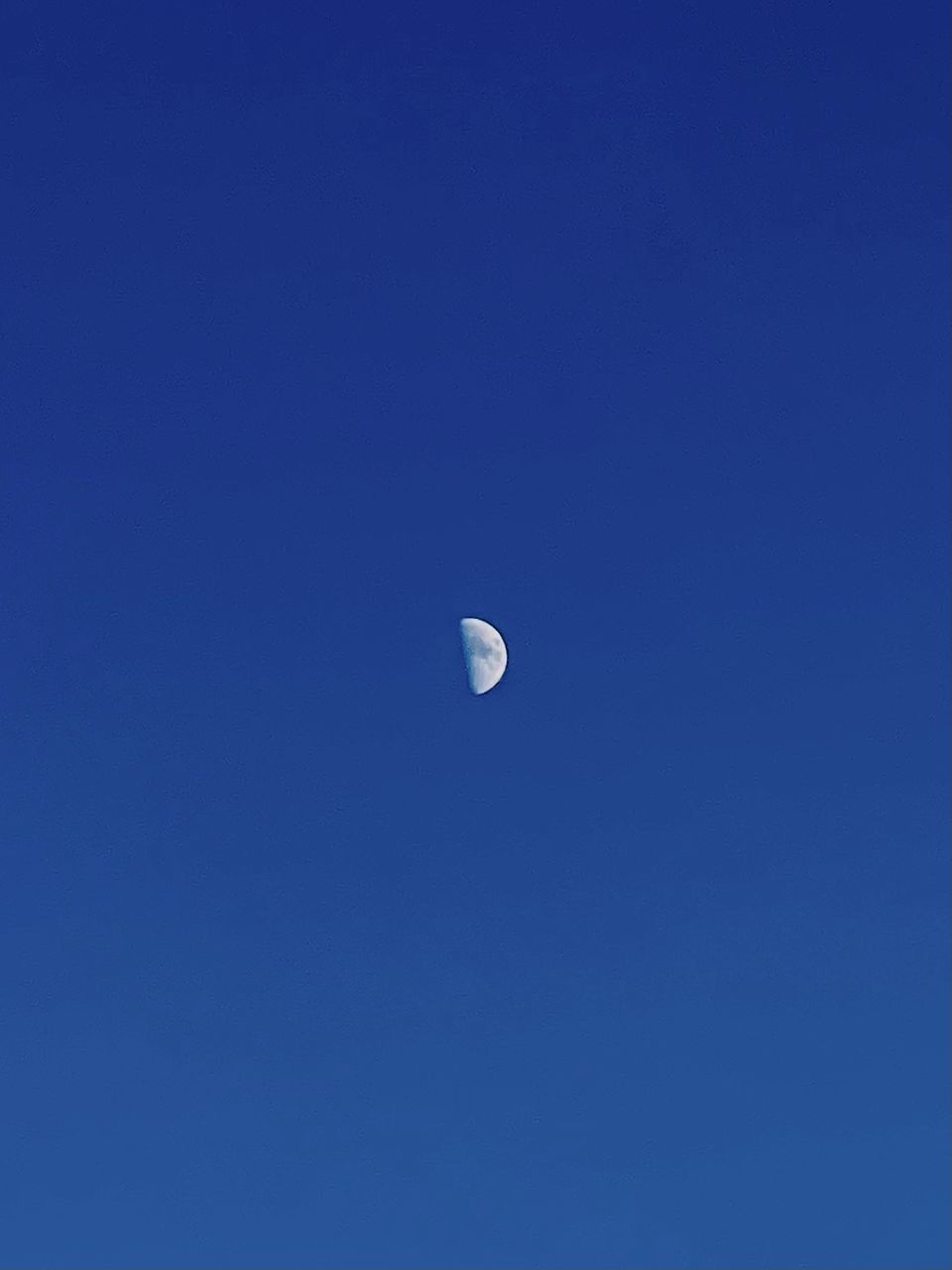 sky, moon, blue, space, clear sky, astronomy, crescent, low angle view, copy space, no people, nature, beauty in nature, night, scenics - nature, tranquility, half moon, tranquil scene, astronomical object, astrology, outdoors, planetary moon, cloud, idyllic