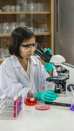 Portrait of scientist examining chemical in laboratory