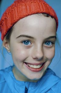 Close-up portrait of a smiling young woman