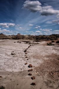 Scenic view of badlands landscape against sky