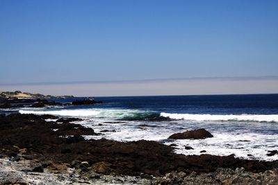 Scenic view of sea against clear sky