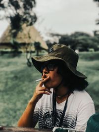 Portrait of young woman wearing sunglasses