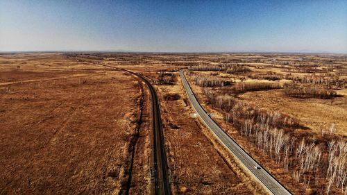 High angle view of railroad tracks against clear sky