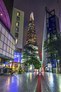 Illuminated buildings in city at night