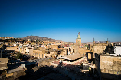 High angle view of townscape against blue sky