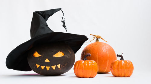 Close-up of pumpkin against orange background