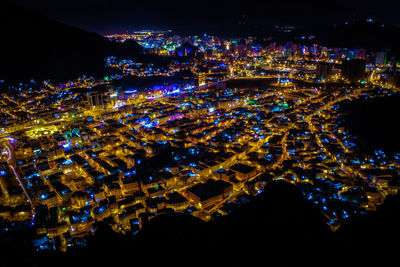 High angle view of illuminated buildings at night