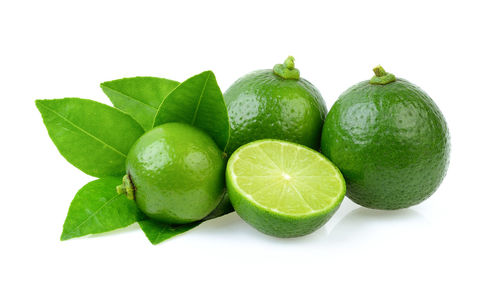 Close-up of fruits against white background