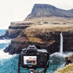 Scenic view of sea and cliff