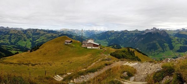 Scenic view of landscape and mountains against sky