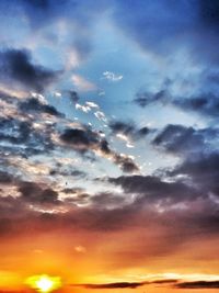 Low angle view of cloudy sky at sunset