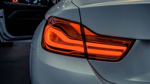 Close-up of illuminated orange car