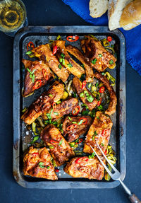 High angle view of meat on barbecue grill