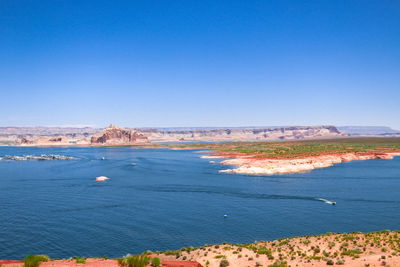 Scenic view of sea against blue sky