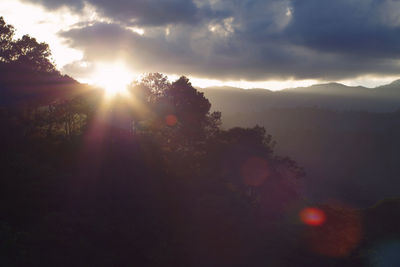 Scenic view of sunset over mountains