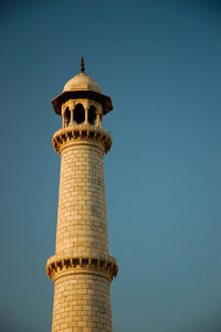 Low angle view of historic building against clear blue sky