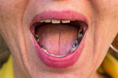 Close-up of woman with mouth open