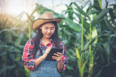 Young woman using smart phone outdoors