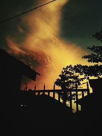 Silhouette of building at sunset