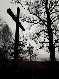 Silhouette of bare tree against sky