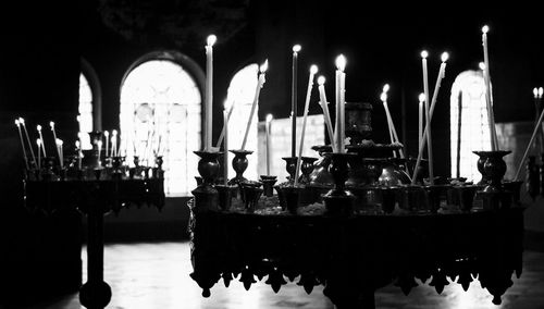 Illuminated candles in church