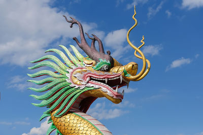 Low angle view of statue against sky