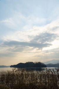 Scenic view of lake against sky during sunset