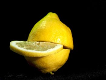 Close-up of lemon against black background