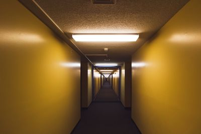 Vanishing point view of illuminated corridor