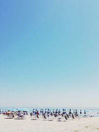 Scenic view of beach against blue sky