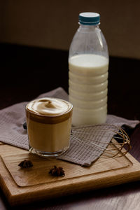 A glass of the popular trendy drink dalgona coffee with milk. whisk and ice. high quality photo