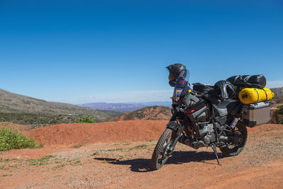 Touring motorbike parked on dirt road, salta, argentina