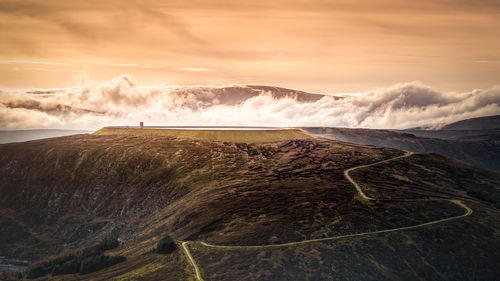 Scenic view of landscape against sky during sunset