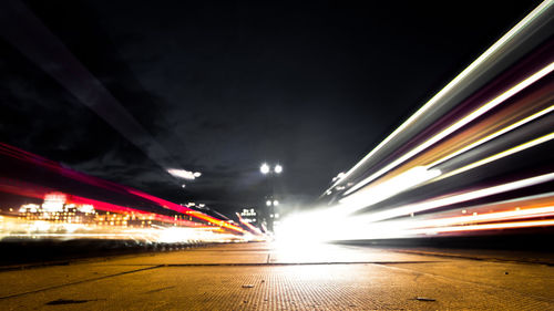 Illuminated city against sky at night